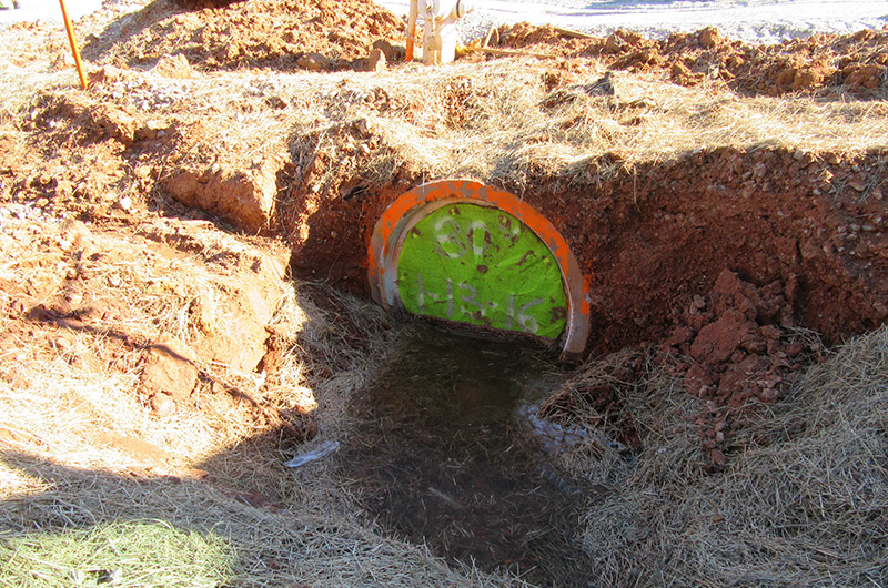 Silt Saver Pipe Stopper in place within a horizontal pipe on an active construction site demonstrating structural integrity, stormwater control and sediment retention.
